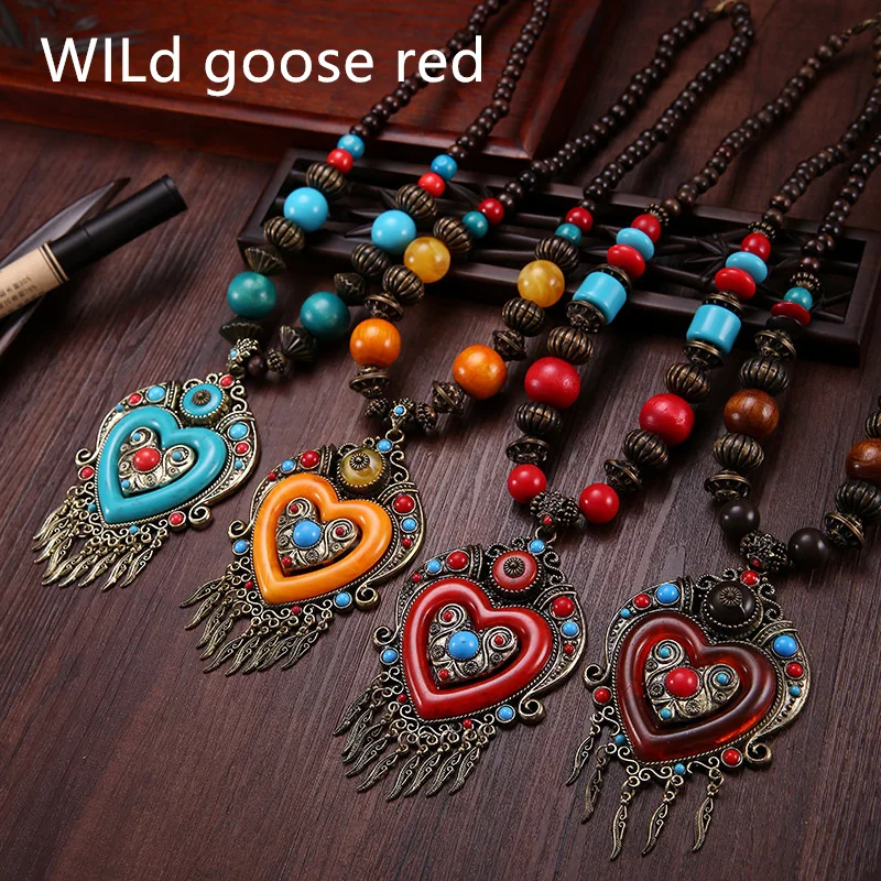 Beaded sweater chain national style necklace varnish resin pendant wood bead heart-shaped hanging jewelry manufacturer wholesale
Beaded sweater chain national style necklace varnish resin pendant wood bead heart-shaped hanging jewelry manufacturer wholesale