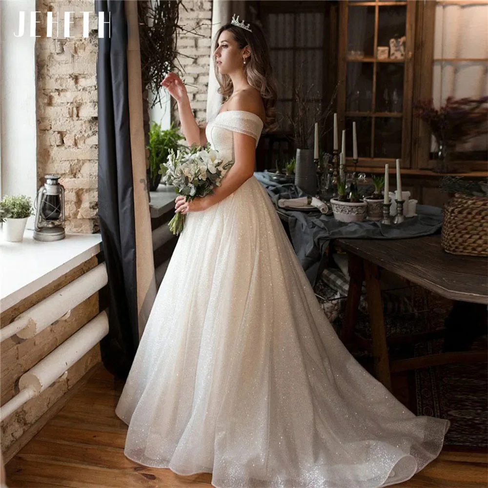 JEHETH Sparkle Tulle Wedding Dresses for Women Off the Shoulder V-Neck A line Lace up Princess Bridal Gowns vestidos de fiesta
JEHETH Sparkle Tulle Wedding Dresses for Women Off the Shoulder V-Neck A line Lace up Princess Bridal Gowns vestidos de fiesta