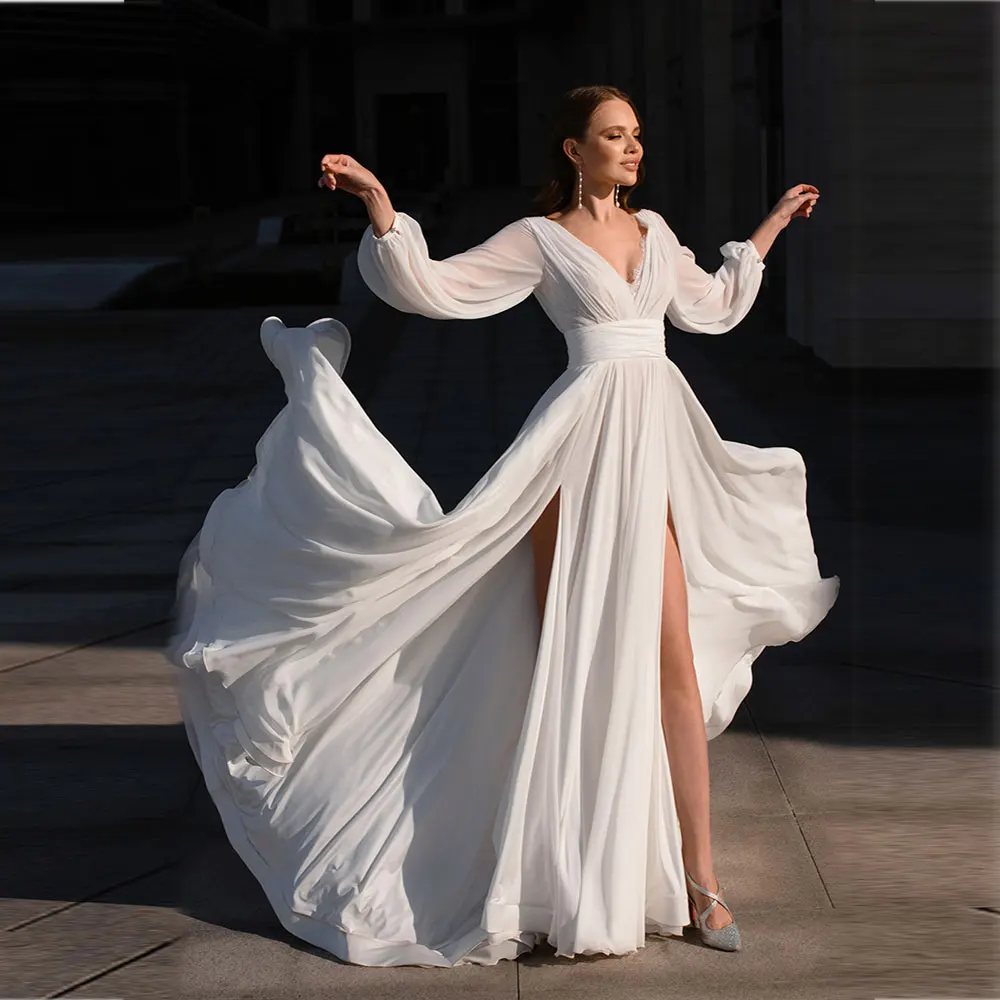 Elegant Chiffon Beach Wedding Dresses Boho Lace Long Sleeve V-Neck Ruched Custom Made Sexy High Slit Bridal Gowns Plus Size 2021
Elegant Chiffon Beach Wedding Dresses Boho Lace Long Sleeve V-Neck Ruched Custom Made Sexy High Slit Bridal Gowns Plus Size 2021