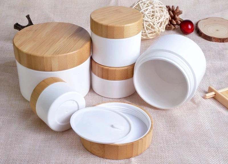 

bamboo cosmetic container 1oz 2oz 30ml 50ml 100ml 250g 150g pp plastic cream jar with wood bamboo lid laser engraving bamboo cap