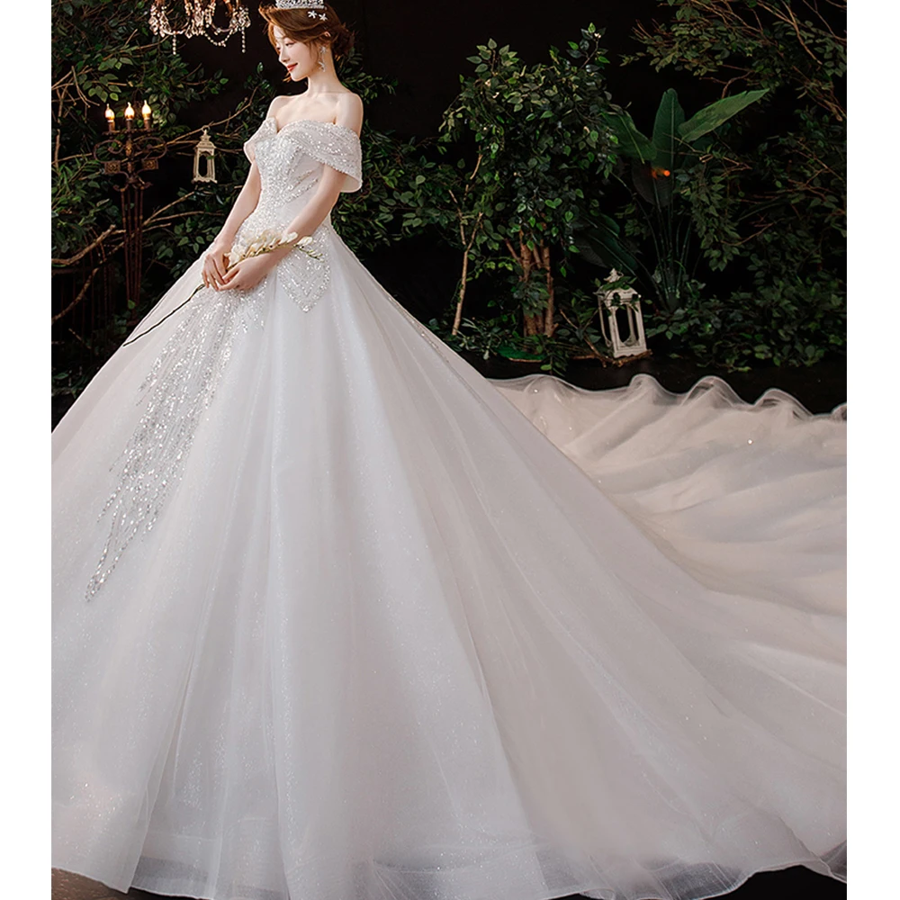Dioflyusa Romantic Luxury Princess Lace Tulle Sexy Wedding Dress 2021 Champagne Boat Neck Generous Elegant Train Brides Gown
Dioflyusa Romantic Luxury Princess Lace Tulle Sexy Wedding Dress 2021 Champagne Boat Neck Generous Elegant Train Brides Gown