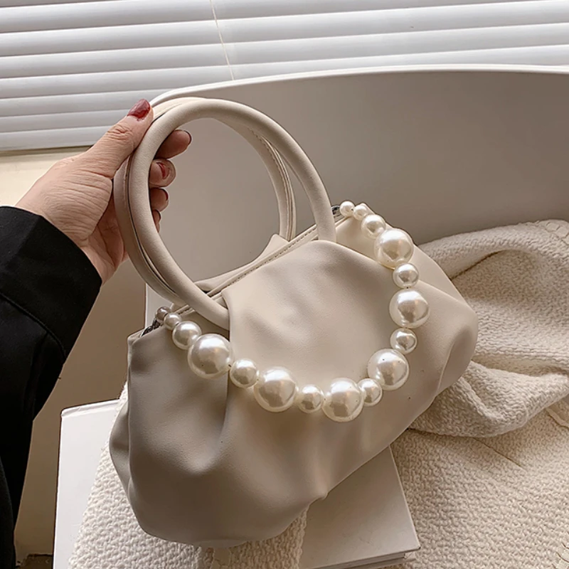 Solid color Pleated Pearl Tote bag 2021 Summer New PU Leather Women's Designer Handbag Luxury brand Small Shoulder Messenger Bag
Solid color Pleated Pearl Tote bag 2021 Summer New PU Leather Women's Designer Handbag Luxury brand Small Shoulder Messenger Bag