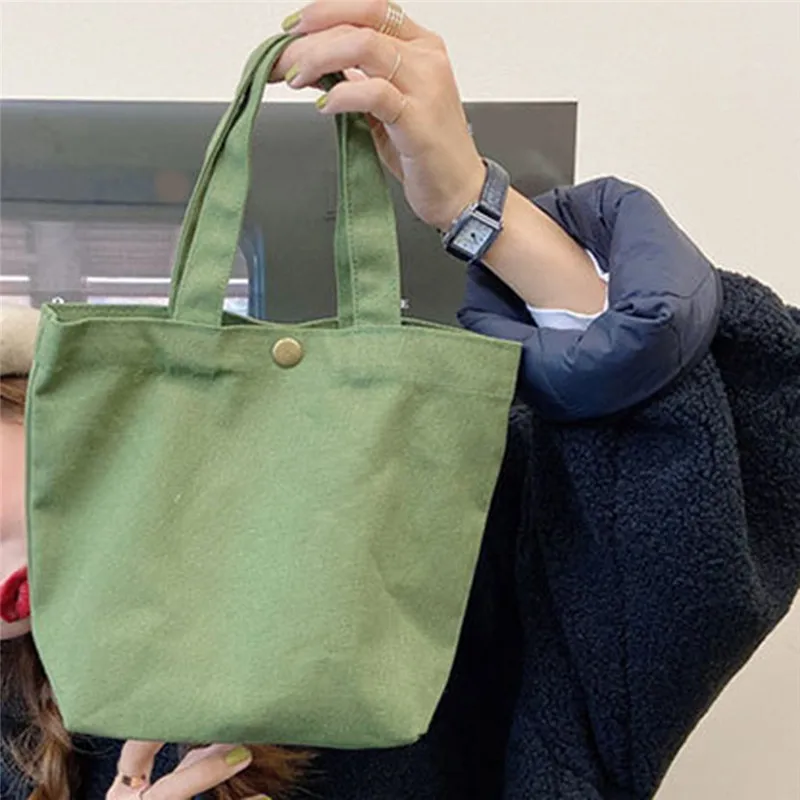 New Handbags Solid Candy Color Canvas Tote Bag Lunch Bag Food Fashion Portable Small Lunchbox Bag With Copper Buckle
New Handbags Solid Candy Color Canvas Tote Bag Lunch Bag Food Fashion Portable Small Lunchbox Bag With Copper Buckle