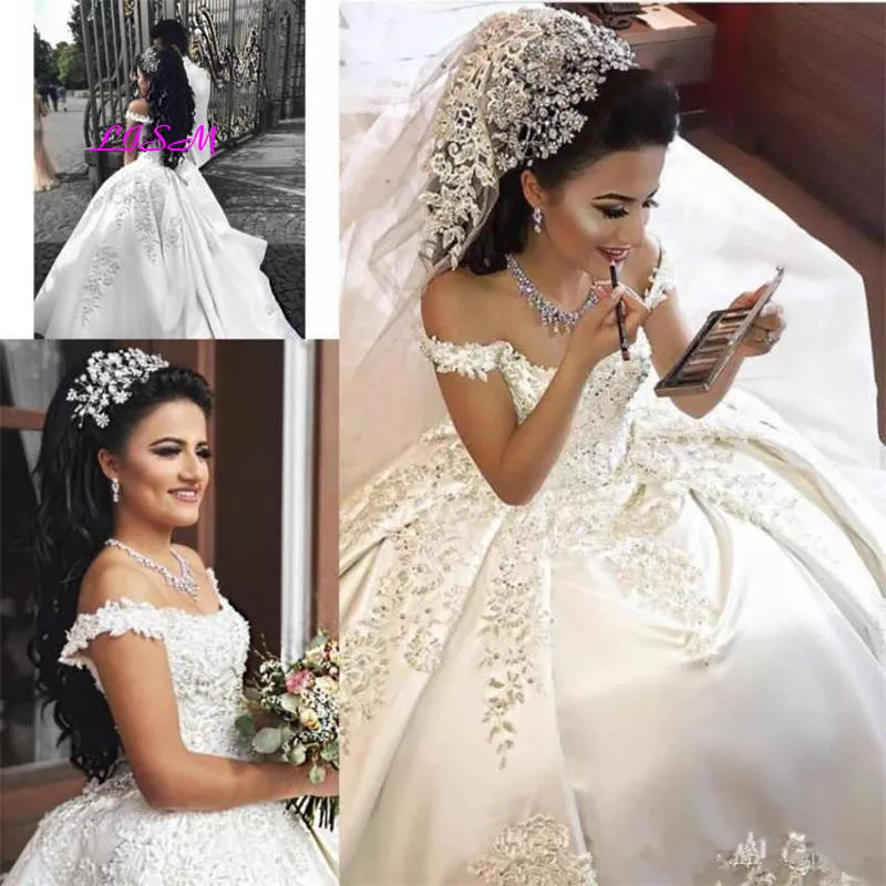 Luxury Off Shoulder Arabic Ball Gown Wedding Dresses Illusion Lace Appliques Crystal Beaded Satin Plus Size Bridal Gowns
Luxury Off Shoulder Arabic Ball Gown Wedding Dresses Illusion Lace Appliques Crystal Beaded Satin Plus Size Bridal Gowns