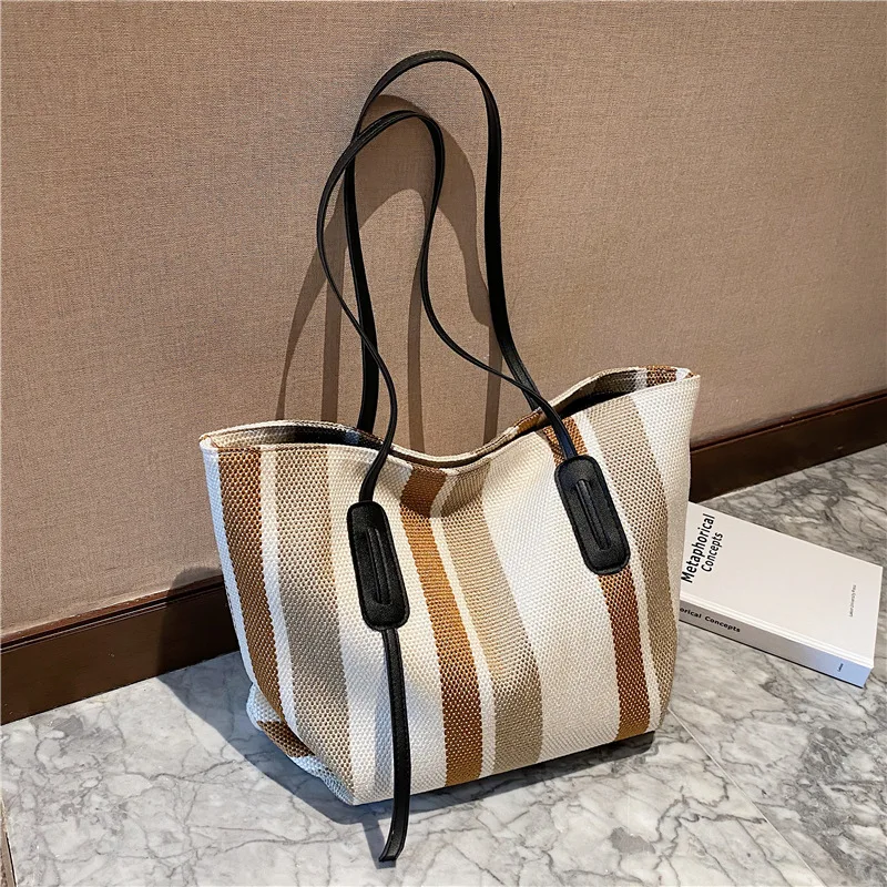 Ladies Fashion Brand Design Stitching Contrasting Color Canvas Shoulder Handbag Large Capacity Shopping Travel Beach Tote Bag
Ladies Fashion Brand Design Stitching Contrasting Color Canvas Shoulder Handbag Large Capacity Shopping Travel Beach Tote Bag