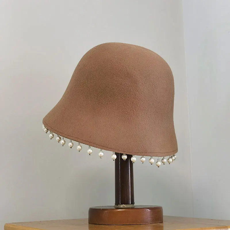 Autumn Winter Korea Catwalk Style 100% Wool Pearl Tassel Lady Bucket Cap Lady Casual Basin Cap Bucket Fishing Hat Sombrero Mujer
Autumn Winter Korea Catwalk Style 100% Wool Pearl Tassel Lady Bucket Cap Lady Casual Basin Cap Bucket Fishing Hat Sombrero Mujer