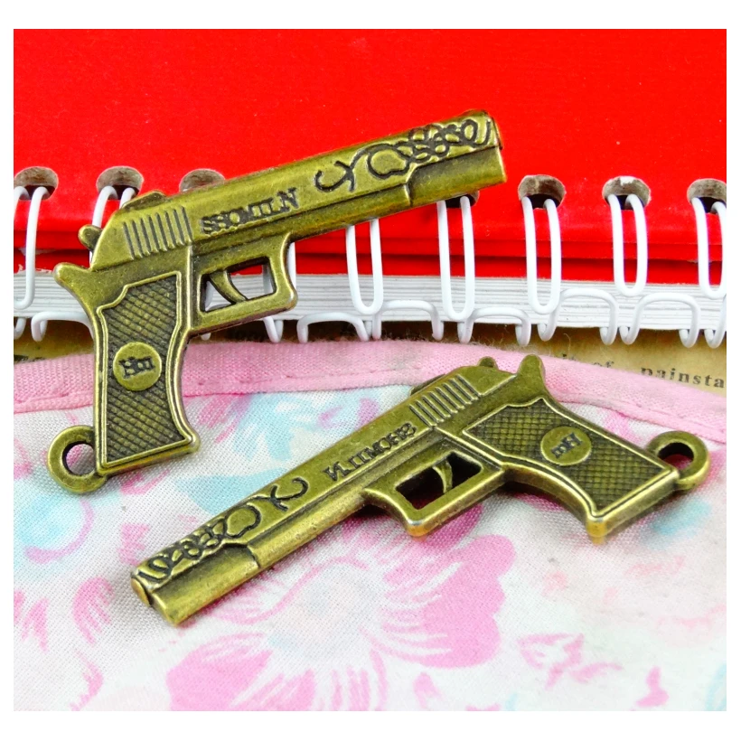 Фото Ожерелье с пистолетами Античная бронза: 8 штук, размер 52*28*4,4 мм, для создания украшений (браслетов, ожерелий, сережек) в стиле DIY.