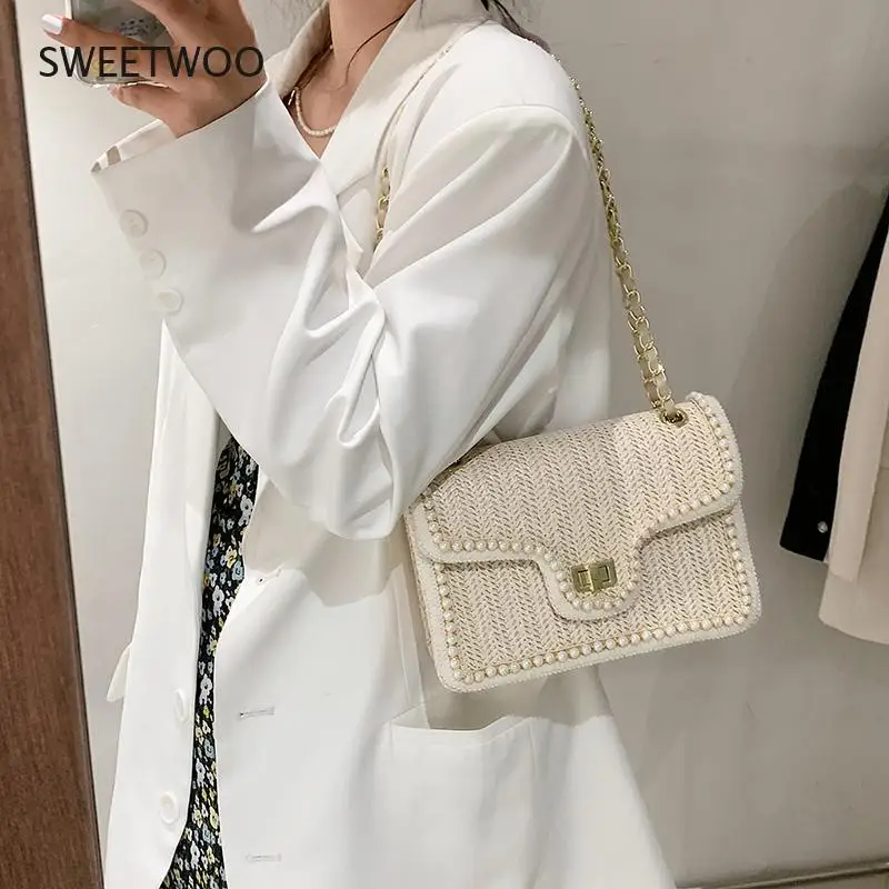 Fashion Pearl Chain Ladies Straw Bag 2021 Summer The New Hand-Woven Straw Shoulder Bag Bohemian Beach Messenger Small Square Bag
Fashion Pearl Chain Ladies Straw Bag 2021 Summer The New Hand-Woven Straw Shoulder Bag Bohemian Beach Messenger Small Square Bag