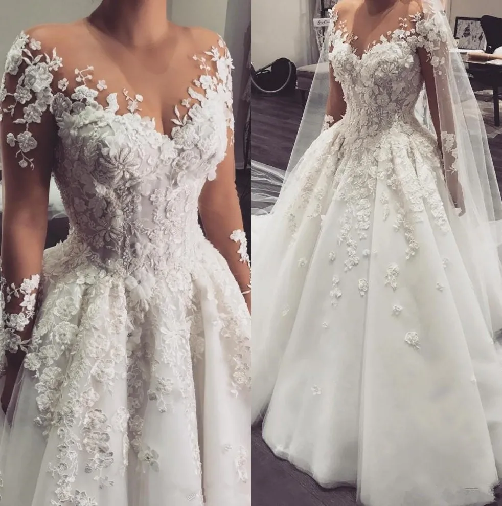 2020 Arabic ONE line Bridal gown Sheer Jewel Neck Long Sleeves 3D Floral lace Appliques Pearls Plus Size dish
2020 Arabic ONE line Bridal gown Sheer Jewel Neck Long Sleeves 3D Floral lace Appliques Pearls Plus Size dish