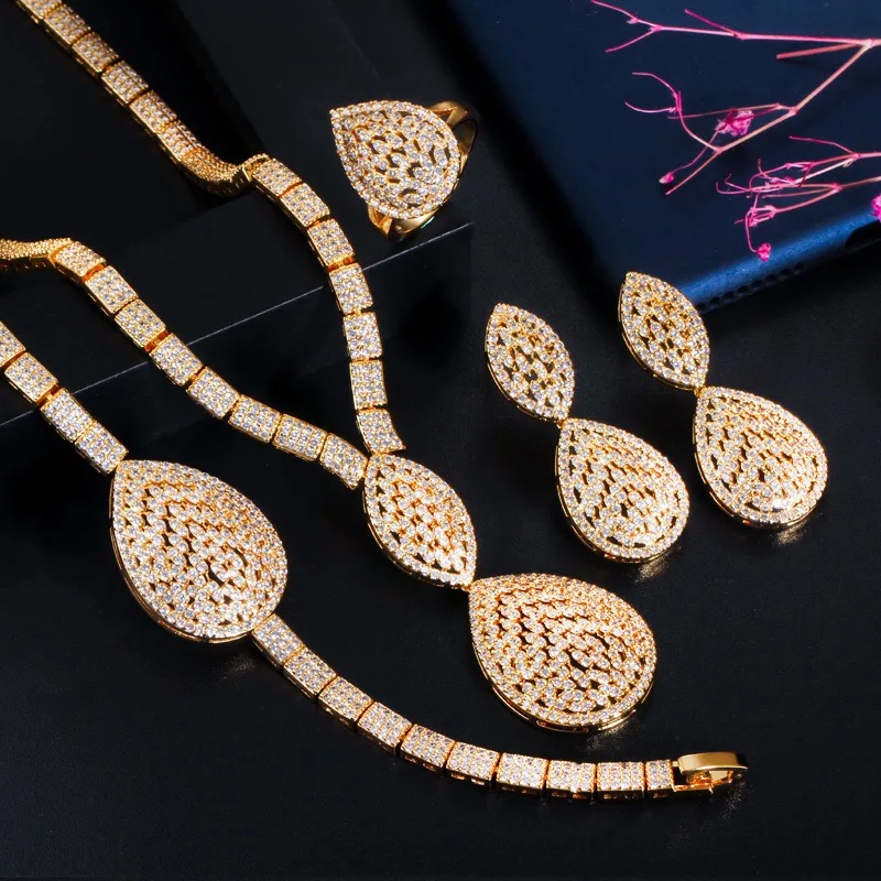 Retro luxury copper necklace earrings bracelet ring set high quality all-crystal zircon women's jewelry set wedding accessories
Retro luxury copper necklace earrings bracelet ring set high quality all-crystal zircon women's jewelry set wedding accessories