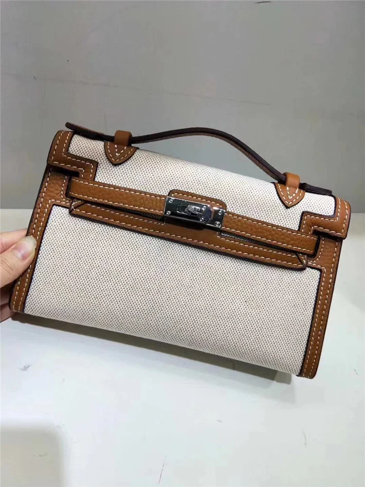 2020 new Kelly canvas with leather handbag Single Shoulder Messenger Handbag casual fashion versatile small square Bag Mini
2020 new Kelly canvas with leather handbag Single Shoulder Messenger Handbag casual fashion versatile small square Bag Mini