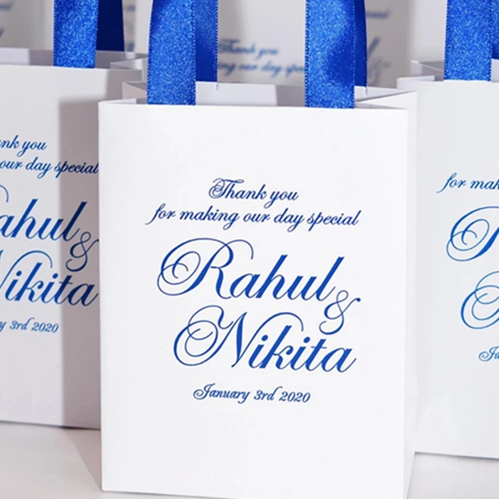 

Personalized Navy Blue Wedding welcome Bags with satin ribbon and your names. Elegant Wedding gift bags for small for guests