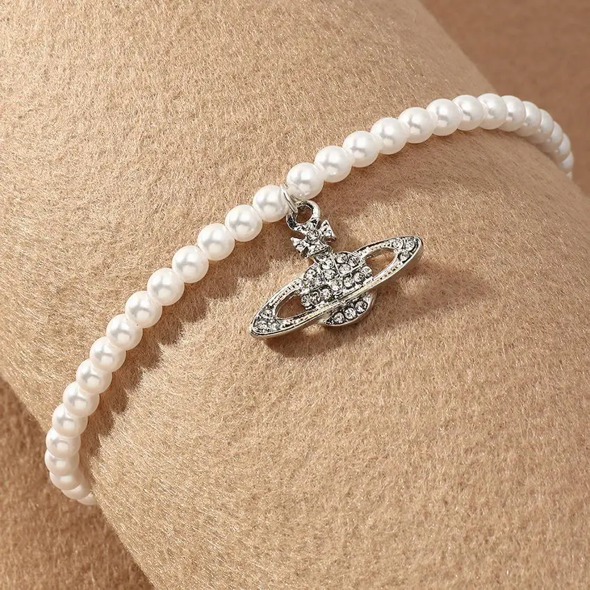 Paved Crystal Saturn Galaxy Pendant Imitated Pearl Anklet for Women Fashion Bohemian Jewelry Wholesale
Paved Crystal Saturn Galaxy Pendant Imitated Pearl Anklet for Women Fashion Bohemian Jewelry Wholesale