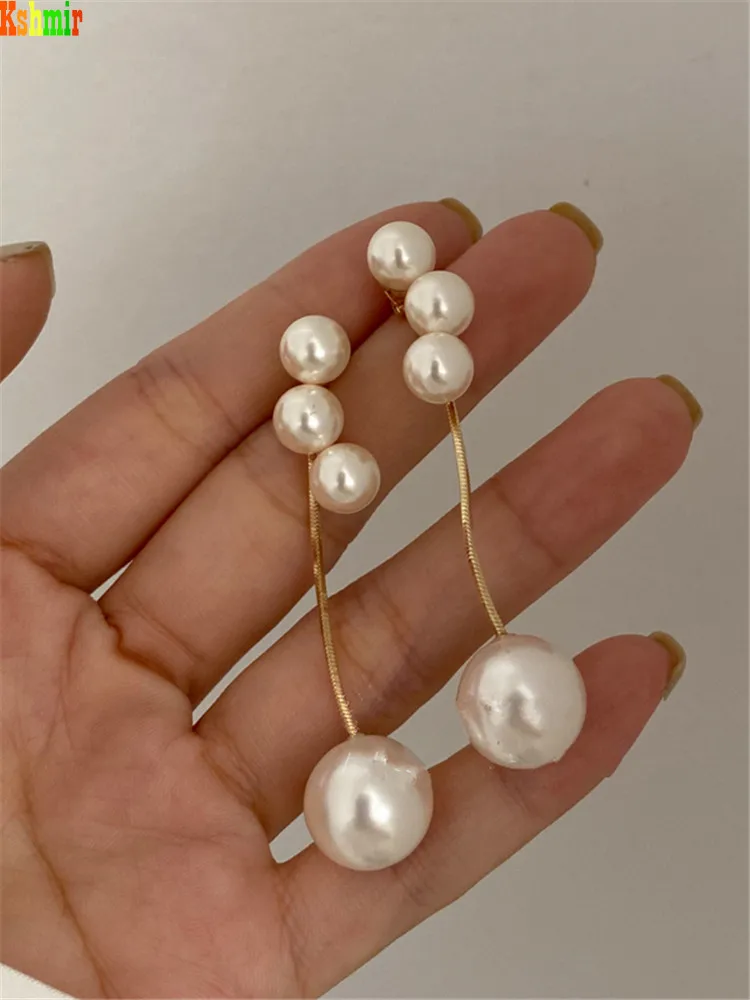 Kshmir New pearl long earrings simple geometric pearl retro metal exquisite French earrings S925 stitches 2020
Kshmir New pearl long earrings simple geometric pearl retro metal exquisite French earrings S925 stitches 2020
