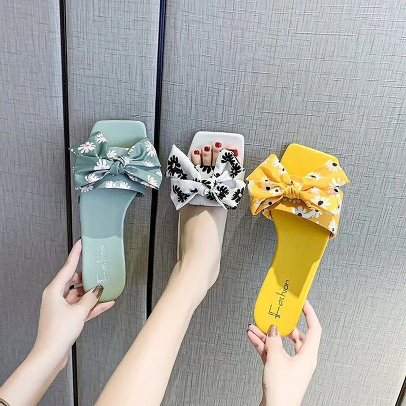 Summer new style casual sandals and slippers with bows and cute outer wear one-word slippers women's shoes
Summer new style casual sandals and slippers with bows and cute outer wear one-word slippers women's shoes