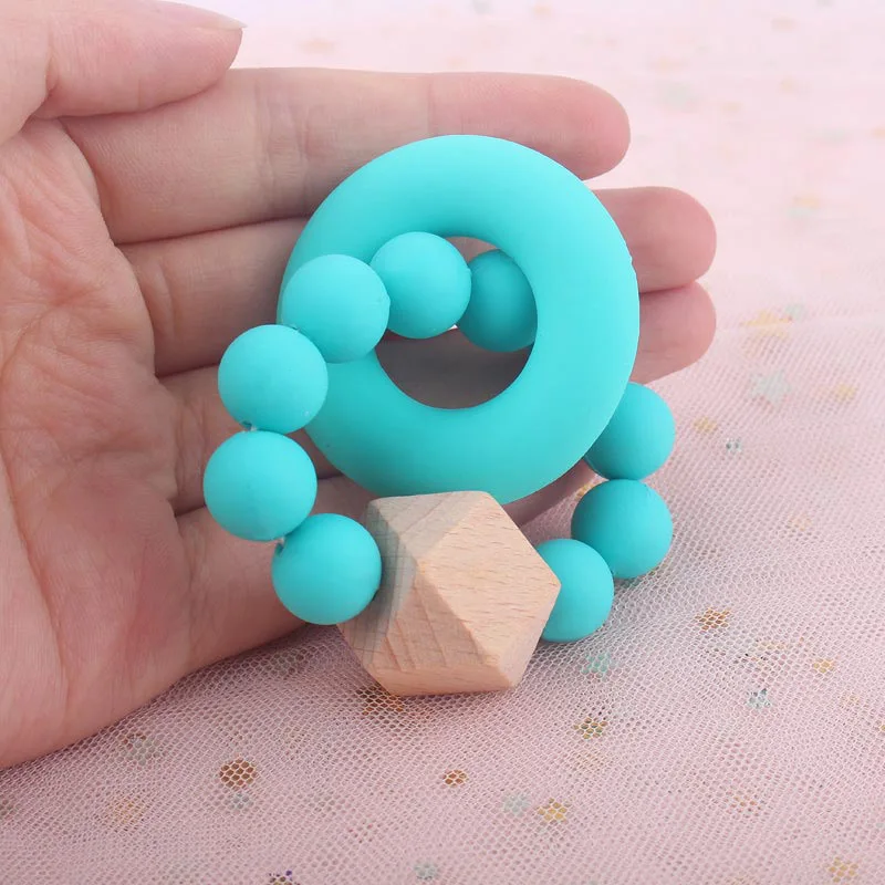 Silicone Baby Teether Bracelet Silicone Ring Beads Chewing Wooden Beads Trolley Rattle For Kids Products Toy
Silicone Baby Teether Bracelet Silicone Ring Beads Chewing Wooden Beads Trolley Rattle For Kids Products Toy