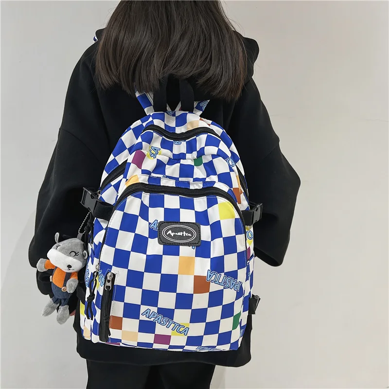 EST Men Fashion Women Plaid Shoulders Waterproof Nylon School Backpack Girls Casual Large Book Unisex Grid Kawaii Pendant Bags
EST Men Fashion Women Plaid Shoulders Waterproof Nylon School Backpack Girls Casual Large Book Unisex Grid Kawaii Pendant Bags