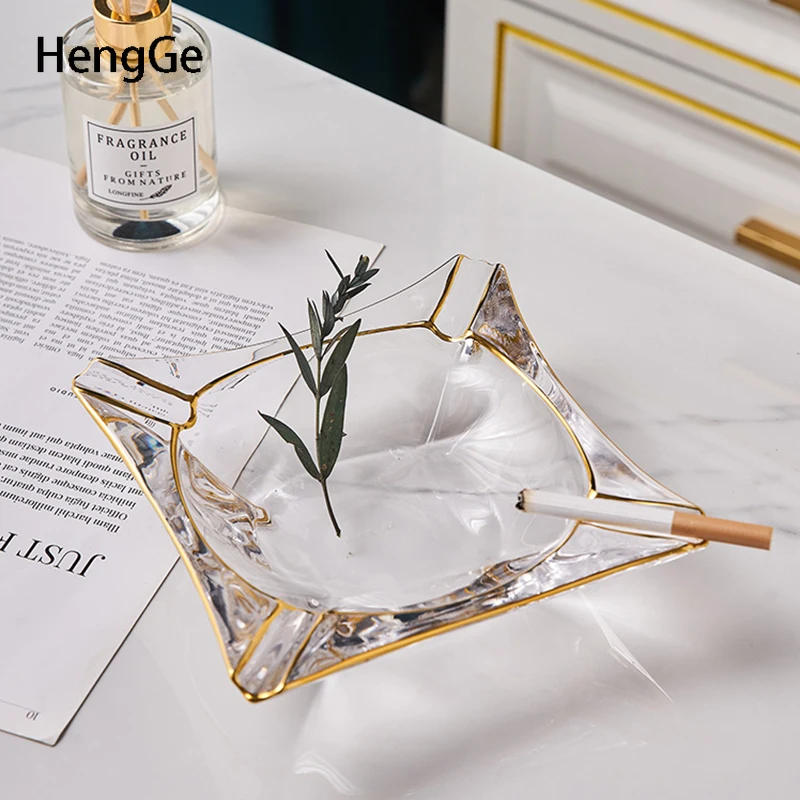 Light Luxury Crystal Glass Ashtray Golden Stroke Decoration Ash Tray Living Room Dining Table Decor European Home Accessories
Light Luxury Crystal Glass Ashtray Golden Stroke Decoration Ash Tray Living Room Dining Table Decor European Home Accessories