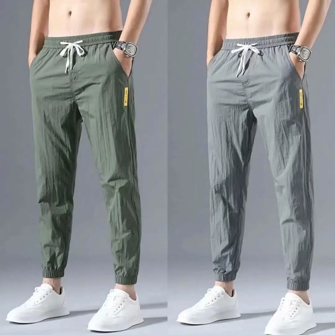 Summer ultra thin ice silk pants men's tooling corset casual pants loose sports air conditioning quick drying men's pants 
Summer ultra thin ice silk pants men's tooling corset casual pants loose sports air conditioning quick drying men's pants