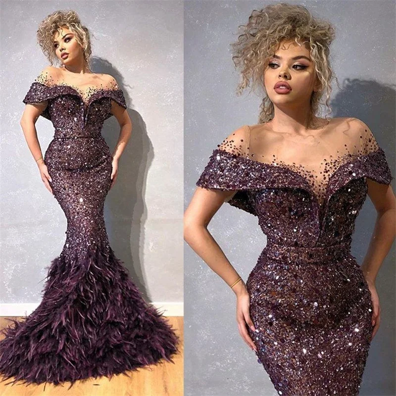 Glitter Mermaid Evening Dresses Sheer Jewel Neck Sequin Beads Feather Prom Dress Capped Short Sleeves Sweep Train Party Gown
Glitter Mermaid Evening Dresses Sheer Jewel Neck Sequin Beads Feather Prom Dress Capped Short Sleeves Sweep Train Party Gown