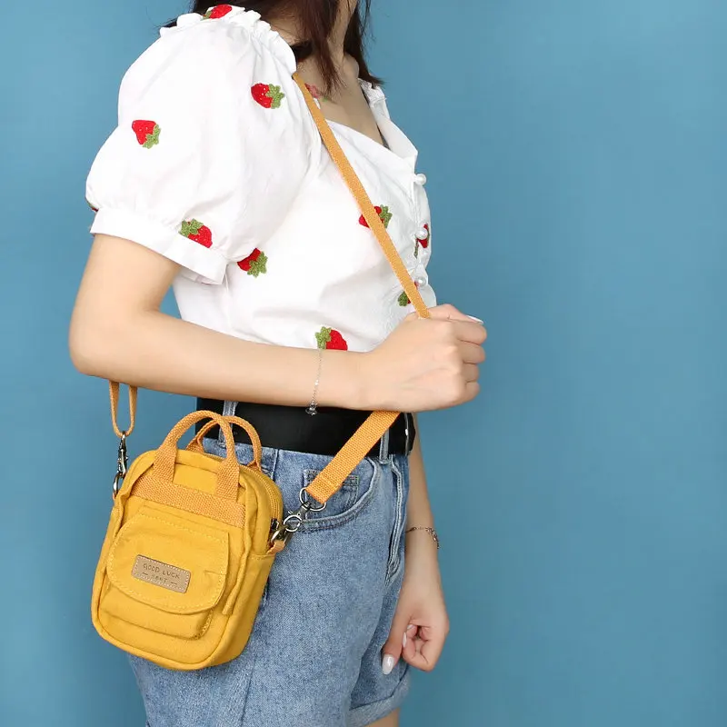 Three-color patch canvas small handbag Unisex all-match shoulder bag literary student messenger mobile phone bags 
Three-color patch canvas small handbag Unisex all-match shoulder bag literary student messenger mobile phone bags