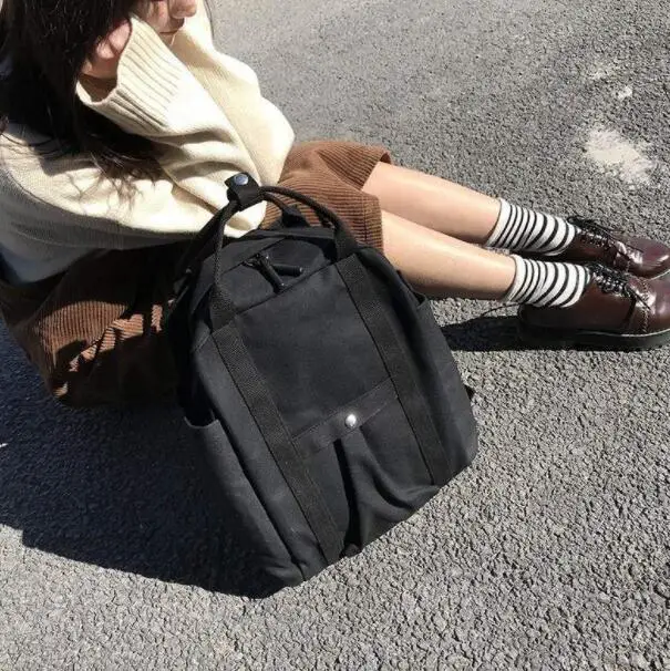 Solid color portable backpack large capacity canvas bag backpack
Solid color portable backpack large capacity canvas bag backpack