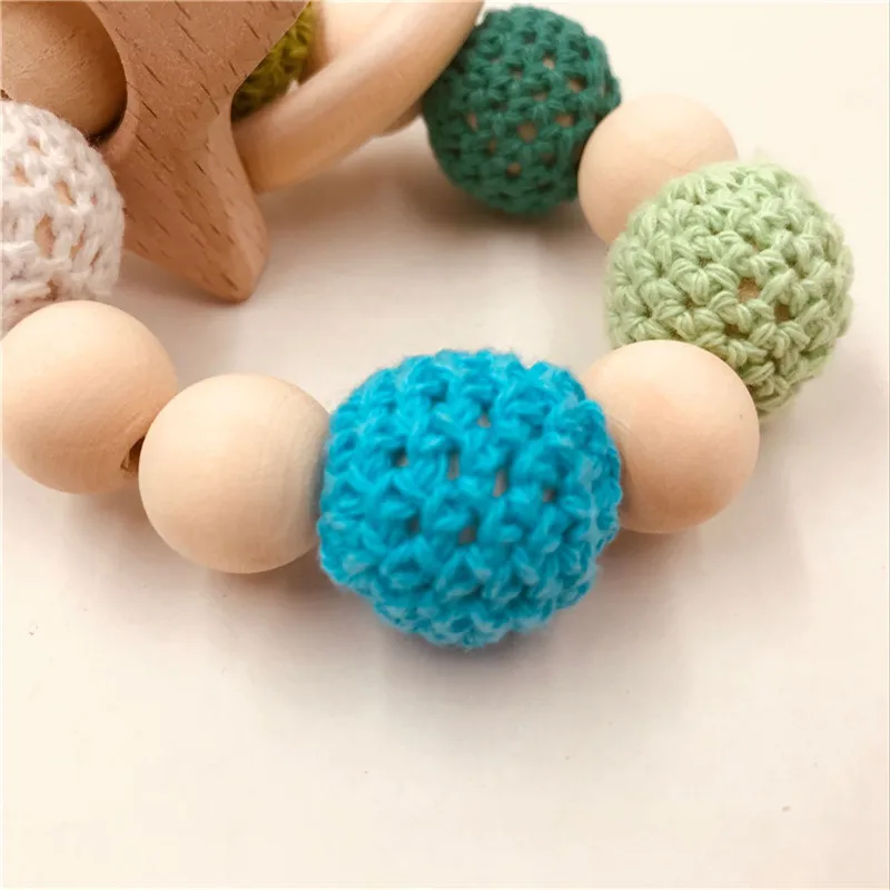 NEW Baby Care Bracelets Wooden Teether Crochet Chew Beads Teething Wooden Rattles Toy Teether Montessori Bracelets Baby Teether
NEW Baby Care Bracelets Wooden Teether Crochet Chew Beads Teething Wooden Rattles Toy Teether Montessori Bracelets Baby Teether