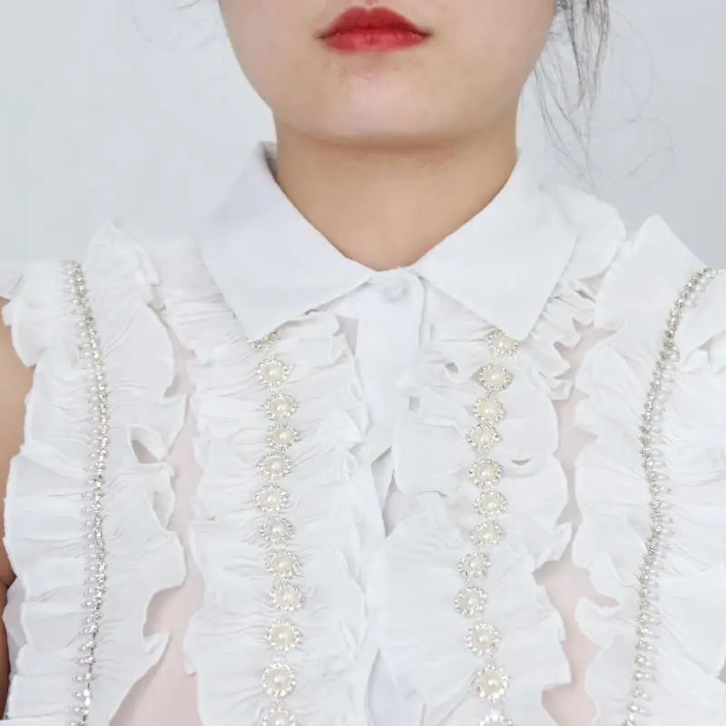 2020 Summer New Luxury Chiffon Ruffled Lapel Black White Shirt Beaded Sleeveless Shirt Tops Women Tide Brand Design Clothes
2020 Summer New Luxury Chiffon Ruffled Lapel Black White Shirt Beaded Sleeveless Shirt Tops Women Tide Brand Design Clothes