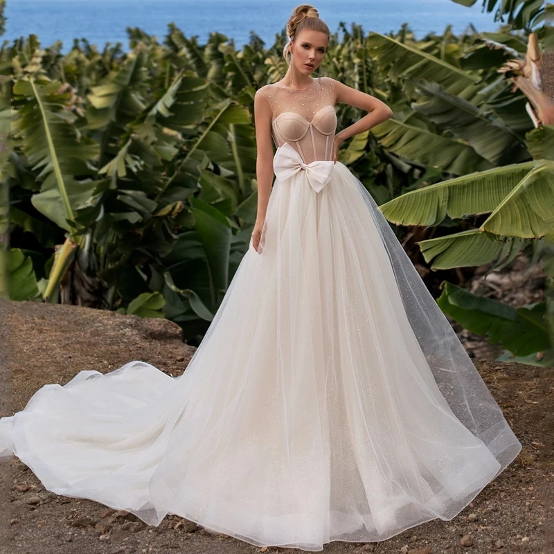 ChuYu Elegant Champagne Tulle Backless Sleeveless Princess Long A-line Bow Wedding Dress 2021 See Through New Arrival
ChuYu Elegant Champagne Tulle Backless Sleeveless Princess Long A-line Bow Wedding Dress 2021 See Through New Arrival