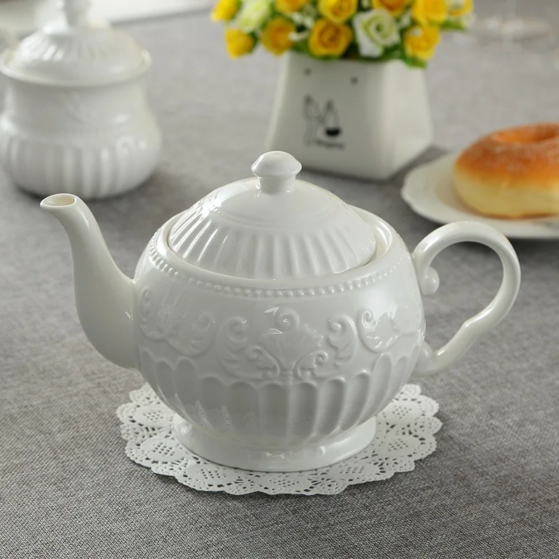900ml White Ceramic Teapot Bone China Teapot With Tea Strainer Elegant Tea Pot Kettle Coffee Pot Home Drinkware Office Tool 
900ml White Ceramic Teapot Bone China Teapot With Tea Strainer Elegant Tea Pot Kettle Coffee Pot Home Drinkware Office Tool