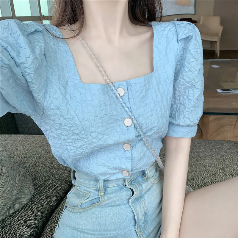 2021 summer new style puff sleeve shirt French sweet square collar clavicle design loose top
2021 summer new style puff sleeve shirt French sweet square collar clavicle design loose top