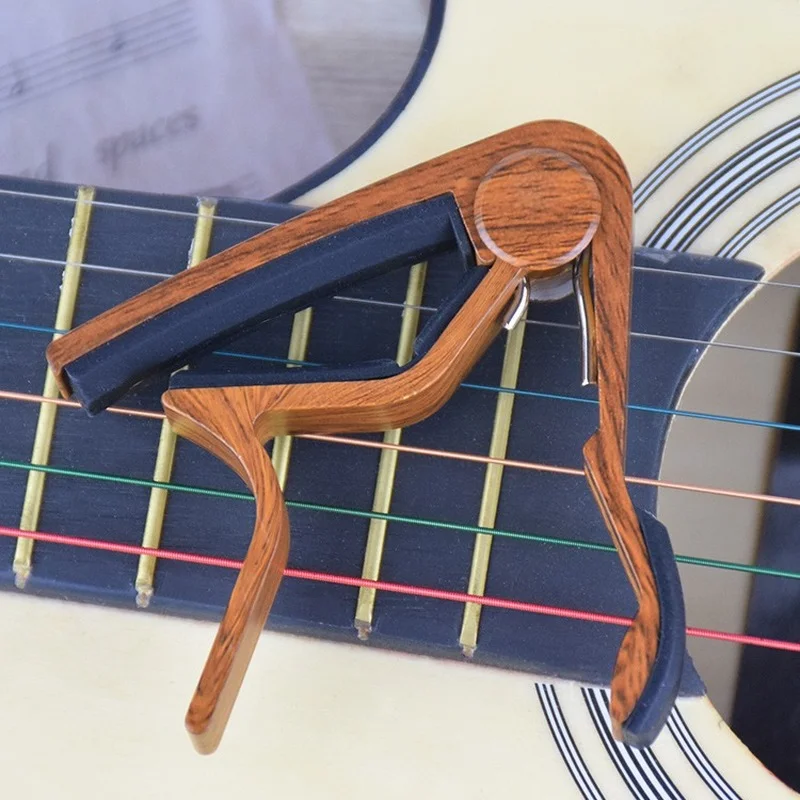 80mm*70mm Wood Guitar Capo High Quality for Guitar Ukulele Musical Instrument Accessories Guitar Capo for Guitar Parts
80mm*70mm Wood Guitar Capo High Quality for Guitar Ukulele Musical Instrument Accessories Guitar Capo for Guitar Parts