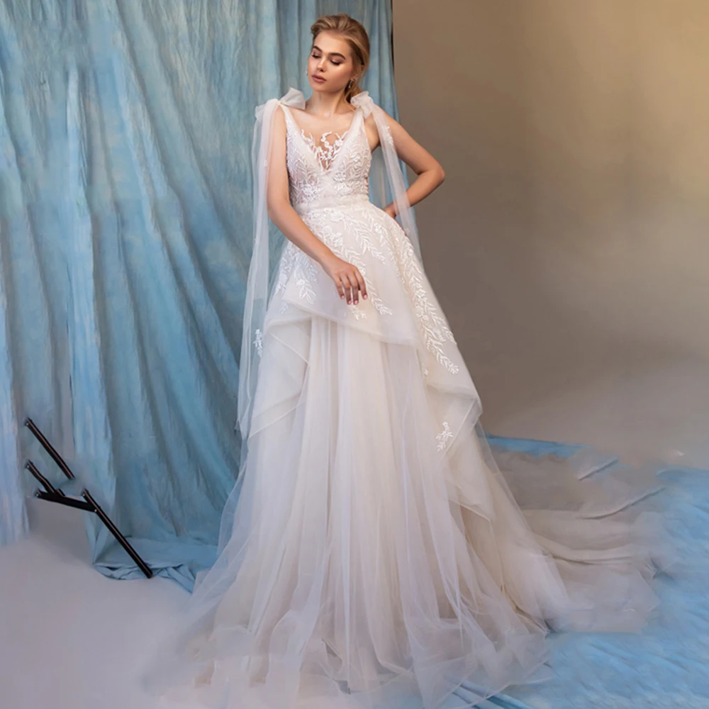 Charming Beach A-Line Wedding Dress Open Back Lace Appliques Sleeveless Beading Court Train Bridal Gowns 2021 Vestido De Noiva
Charming Beach A-Line Wedding Dress Open Back Lace Appliques Sleeveless Beading Court Train Bridal Gowns 2021 Vestido De Noiva