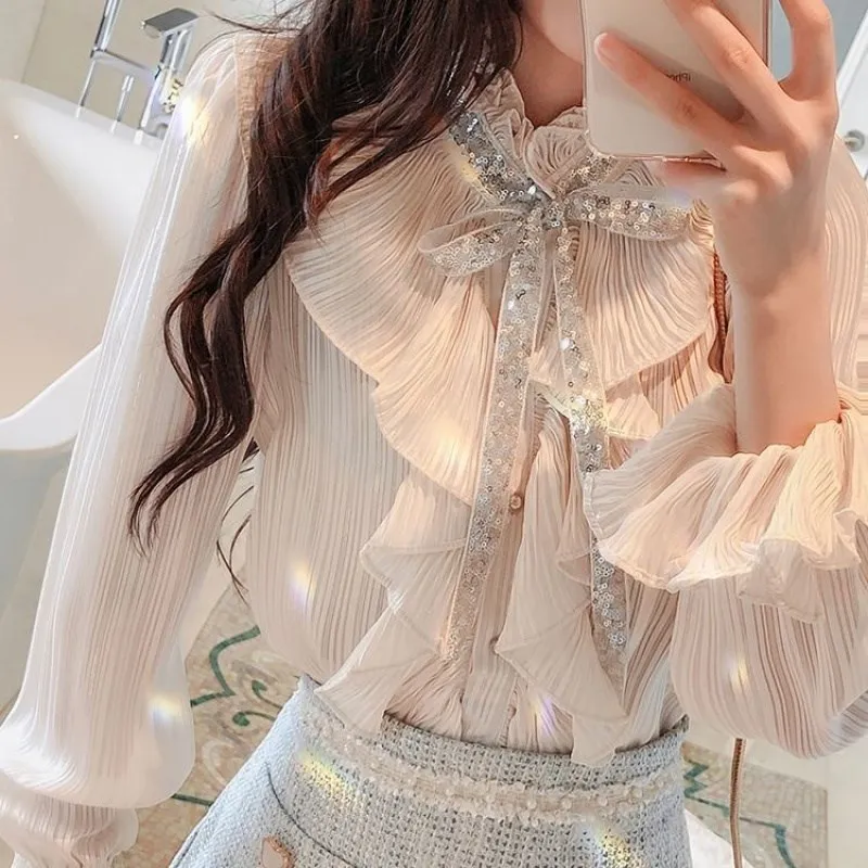 Woman Spring Summer Stand Collar Pleated Chiffon Shirt Long Trumpet Sleeve Sequins Bowtie Ruffled Blouses Crop Tops Blusas 2021
Woman Spring Summer Stand Collar Pleated Chiffon Shirt Long Trumpet Sleeve Sequins Bowtie Ruffled Blouses Crop Tops Blusas 2021