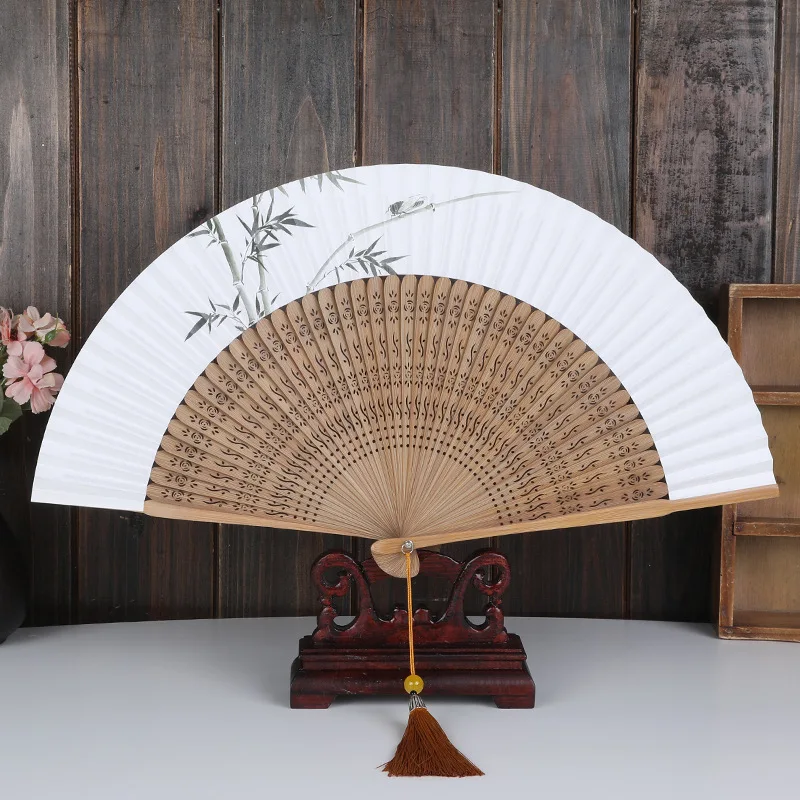 New Chinese elegant solid wood printed rice paper fan is simple, elegant and unpretentious paper hand fan folding hand fans
New Chinese elegant solid wood printed rice paper fan is simple, elegant and unpretentious paper hand fan folding hand fans