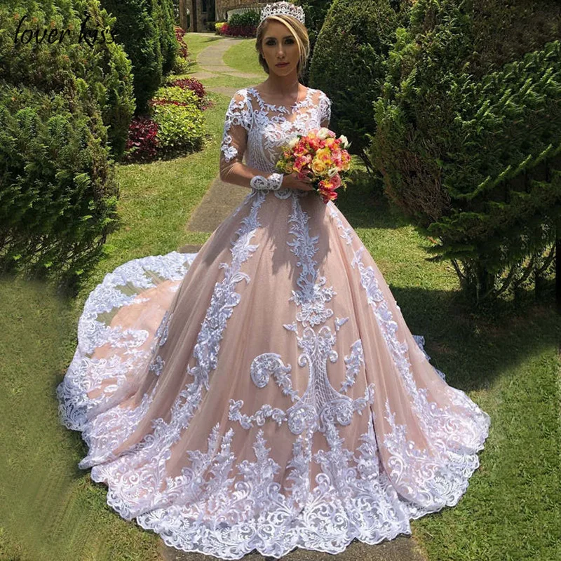Lover Kiss Champagne Luxury Wedding Dresses Long Sleeves Lace Appliques O-Neck Lace Up Bride Dress Bridal Gowns Robe de Mariage 
Lover Kiss Champagne Luxury Wedding Dresses Long Sleeves Lace Appliques O-Neck Lace Up Bride Dress Bridal Gowns Robe de Mariage