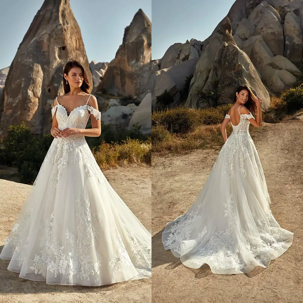 2021 Wedding Dresses Spaghetti Straps Off Shoulder Appliques Lace Bridal Gowns Sexy Open Back Sweep Train A Line Wedding Dress
2021 Wedding Dresses Spaghetti Straps Off Shoulder Appliques Lace Bridal Gowns Sexy Open Back Sweep Train A Line Wedding Dress
