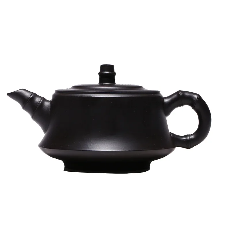 Famous craftsman's hand engraving of Yixing raw ore black clay pillar base purple clay teapot gift
Famous craftsman's hand engraving of Yixing raw ore black clay pillar base purple clay teapot gift