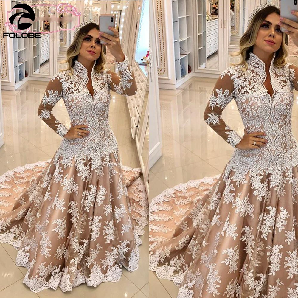 2020 A Line Wedding Dresses High Neck Backless Ivory Lace Appliques Champagne Lining Long Sleeve Vestido Novia Bridal Gown
2020 A Line Wedding Dresses High Neck Backless Ivory Lace Appliques Champagne Lining Long Sleeve Vestido Novia Bridal Gown