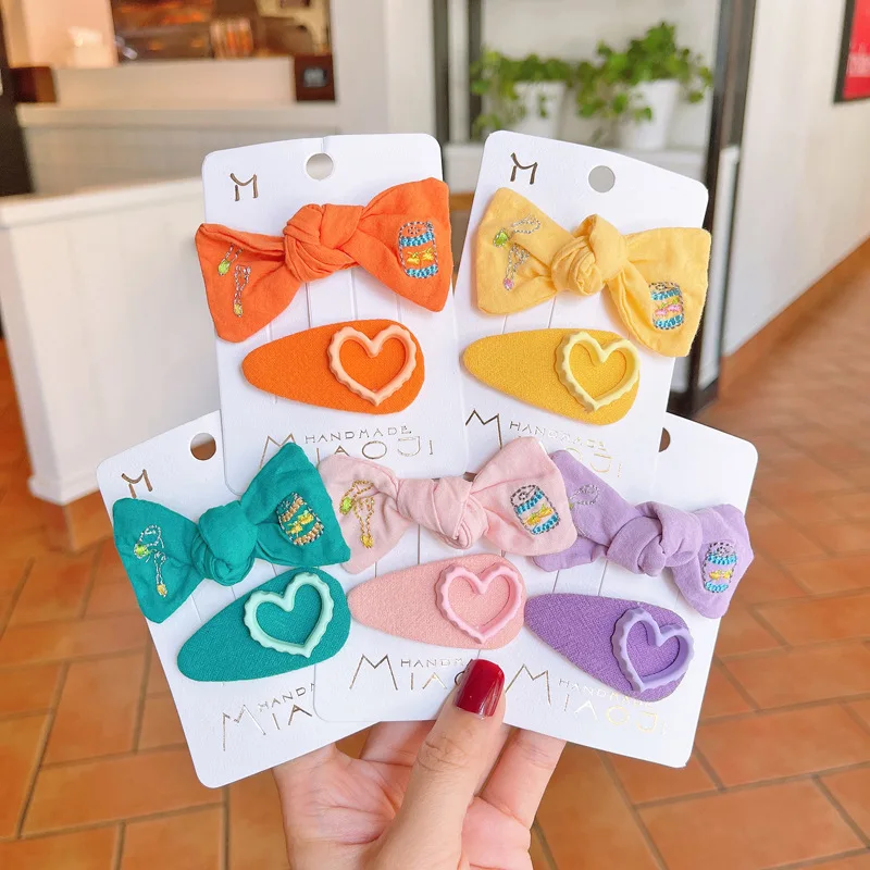 2PCS Korea Sweet Girl Beautiful Solid Color Fabric Embroider Bow Hairpin Headwear Fashion Cute Children BB Clip Hair Accessories
2PCS Korea Sweet Girl Beautiful Solid Color Fabric Embroider Bow Hairpin Headwear Fashion Cute Children BB Clip Hair Accessories