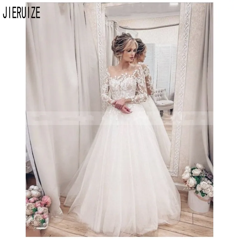 JIERUIZE Romantic Boho Wedding Dresses Long Sleeves Sheer Scoop Neck Lace Appliques Button Back Wedding Gowns Vestido De Noiva 
JIERUIZE Romantic Boho Wedding Dresses Long Sleeves Sheer Scoop Neck Lace Appliques Button Back Wedding Gowns Vestido De Noiva