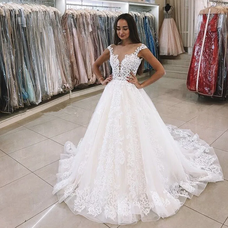 Cap Sleeves Wedding Dress Sheer Scoop Neck Princess Ball Gown Romantic Lace Appliques Backless Tulle Ukraine Bride Wedding Gowns
Cap Sleeves Wedding Dress Sheer Scoop Neck Princess Ball Gown Romantic Lace Appliques Backless Tulle Ukraine Bride Wedding Gowns
