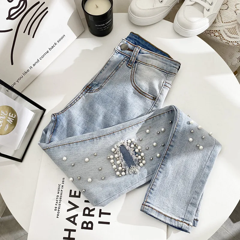 New advanced sense of light color female straight hole jeans chic tall waist tight pants stretch feet nine points
New advanced sense of light color female straight hole jeans chic tall waist tight pants stretch feet nine points