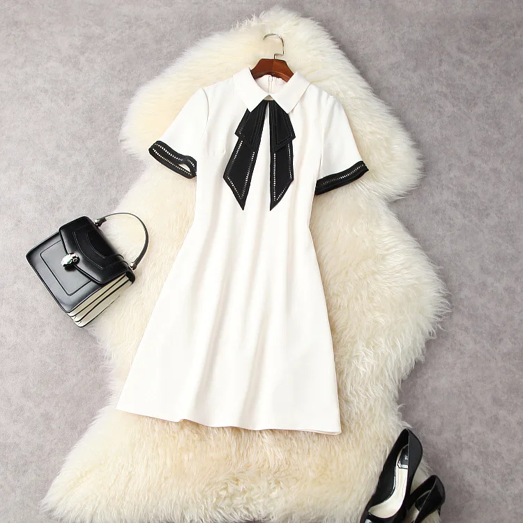European and American women's wear for summer 2021 Short sleeve lapel Hollow bow Fashion dress in solid color
European and American women's wear for summer 2021 Short sleeve lapel Hollow bow Fashion dress in solid color