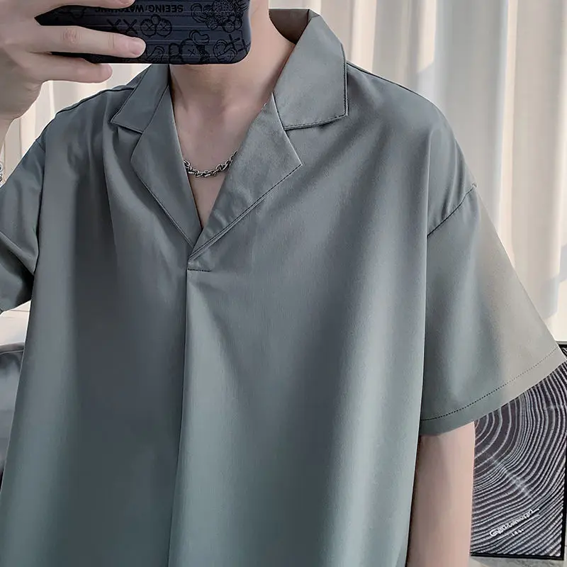 Ice silk black shirt men's short sleeves loose Korean version of summer shirt men handsome trend solid color five-sleeve top
Ice silk black shirt men's short sleeves loose Korean version of summer shirt men handsome trend solid color five-sleeve top