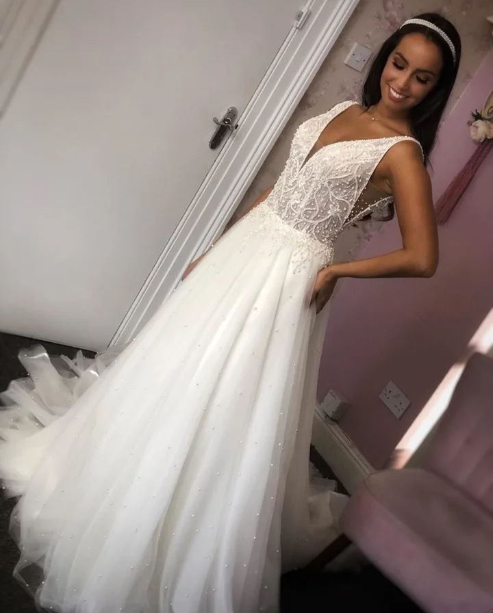 Simple A Line Long Wedding Dresses New V Neck Sleeveless Beading Tull Sweep Strain Formal Wedding Gowns Bridal Dress
Simple A Line Long Wedding Dresses New V Neck Sleeveless Beading Tull Sweep Strain Formal Wedding Gowns Bridal Dress