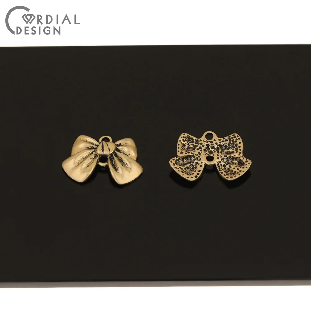 Cordial Design 100Pcs 16*23MM Jewelry Accessories/Bow Shape/Antique Matte Gold/DIY Charms/Hand Made/Jewelry Findings & Component
Cordial Design 100Pcs 16*23MM Jewelry Accessories/Bow Shape/Antique Matte Gold/DIY Charms/Hand Made/Jewelry Findings & Component