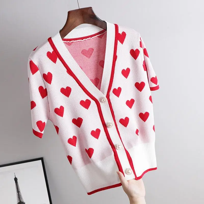 2021 summer new love sweet age reduction V-neck pearl button short sleeve knitted ice silk cardigan loose top
2021 summer new love sweet age reduction V-neck pearl button short sleeve knitted ice silk cardigan loose top