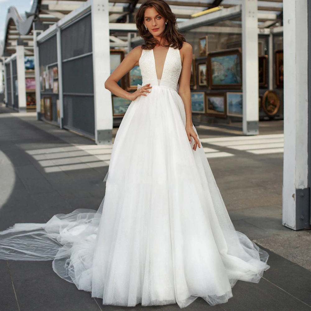 A-Line V-Neck Boho Wedding Dress Tulle Sleeveless Keyhole Back Beading Bow Sweep Train 2021 Bride Gowns Vestido De Noiva
A-Line V-Neck Boho Wedding Dress Tulle Sleeveless Keyhole Back Beading Bow Sweep Train 2021 Bride Gowns Vestido De Noiva