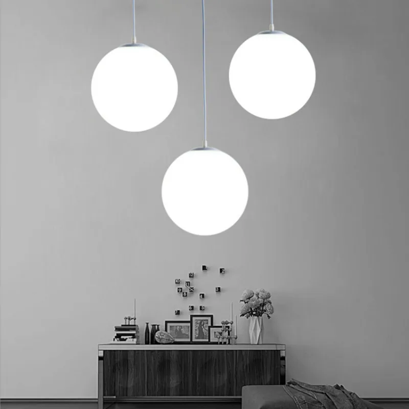 Simple White Glass Ball Hanging Lamps Modern Light Fixture Dining Room Bedroom Living Room Pendant Art Home Decor Pendant Lamps 
Simple White Glass Ball Hanging Lamps Modern Light Fixture Dining Room Bedroom Living Room Pendant Art Home Decor Pendant Lamps
